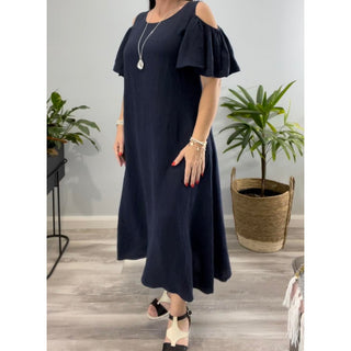 The Chloe Cold Shoulder Dress is a stunning and versatile addition to your wardrobe. Crafted from high-quality linen, this midi-length dress exudes elegance and sophistication.