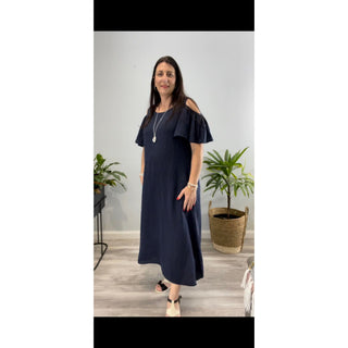 The Chloe Cold Shoulder Dress is a stunning and versatile addition to your wardrobe. Crafted from high-quality linen, this midi-length dress exudes elegance and sophistication.