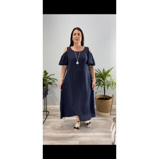 The Chloe Cold Shoulder Dress is a stunning and versatile addition to your wardrobe. Crafted from high-quality linen, this midi-length dress exudes elegance and sophistication.