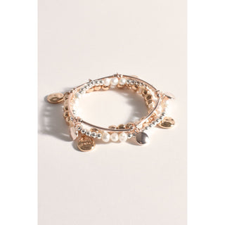 Introducing our Tri-Colored Stacked Bracelet, a chic and versatile accessory designed to enhance your style effortlessly. This unique bracelet features three strands in warm gold, cool silver, and trendy rose gold tones, creating a harmonious blend of colors that complements any outfit.