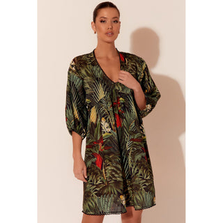 ive headfirst into summer with the Wilma Tropical Dress! Crafted from light linen and covered in a vibrant tropical print, this midi dress has all the makings for a delightful summer outfit for every occasion.