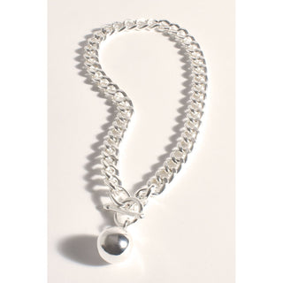 Elevate your style with our exquisite Silver Ball Pendant Necklace. This stunning piece features a silver-plated chain that drapes around your neck, adding a touch of elegance to any outfit. Shop our beautiful range of accessories at Love Moi Boutique.