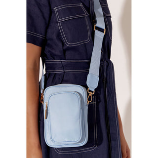 Our Peggy Cross Body Bag is the ideal every day bag to take you anywhere you want to go and is perfect for adding a sports luxe vibe to almost any look! Zip top closure Two storage compartments for phone and purse. Adjustable webbing strap Removable strap Internal pocket with zip Plenty of room for necessities