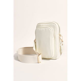 Our Peggy Cross Body Bag is the ideal every day bag to take you anywhere you want to go and is perfect for adding a sports luxe vibe to almost any look! Zip top closure Two storage compartments for phone and purse. Adjustable webbing strap Removable strap Internal pocket with zip Plenty of room for necessities