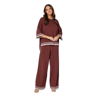 The Frankie Set is a cozy knit ensemble featuring a rich chocolate brown fabric with contrasting cream edgings. The top is designed with 3/4 length sleeves, providing a comfortable and stylish fit. Perfect Lounge or day wear. Shop Online at Love Moi Boutique.