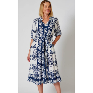 Introducing the Peta Shirt Dress - the epitome of timeless elegance and relaxed sophistication. Crafted from a luxurious blend of linen and cotton, this midi-length dress is a fusion of comfort and style that seamlessly transitions from day to evening, making it a versatile addition to your wardrobe.