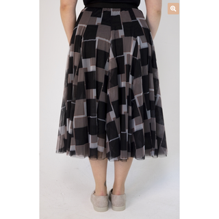 Our Sophia Tulle Skirt in a striking abstract square pattern, creating a unique and fashion-forward statement piece. The skirt features a classic black base color with an all-over black square print, with a contrasting red and white lines making it a versatile addition to any wardrobe.