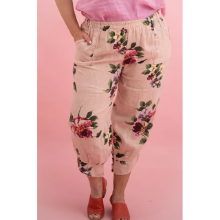 Our Penny Floral Pants – where style meets comfort. Picture yourself in cropped elegance, adorned with a charming cuffed hem and three wood buttons, exuding subtle sophistication with a slight balloon effect. These one-size-fits-all wonders (10-16) are not just pants; they're an invitation to effortless chic.