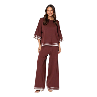 The Frankie Set is a cozy knit ensemble featuring a rich chocolate brown fabric with contrasting cream edgings. The top is designed with 3/4 length sleeves, providing a comfortable and stylish fit. Perfect Lounge or day wear. Shop Online at Love Moi Boutique.