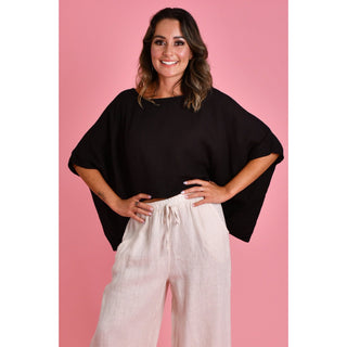 The Amalfi Linen Top is a stylish One Size and versatile piece designed with fashion-conscious individuals in mind. Crafted from 100% linen, it offers both comfort and breathability, making it ideal for various weather conditions. Shop Now at Love Moi Boutique.