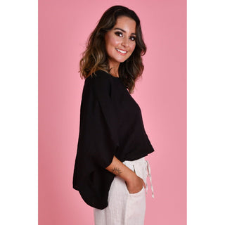 The Amalfi Linen Top is a stylish One Size and versatile piece designed with fashion-conscious individuals in mind. Crafted from 100% linen, it offers both comfort and breathability, making it ideal for various weather conditions. Shop Now at Love Moi Boutique.