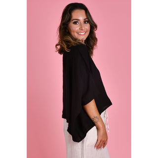 The Amalfi Linen Top is a stylish One Size and versatile piece designed with fashion-conscious individuals in mind. Crafted from 100% linen, it offers both comfort and breathability, making it ideal for various weather conditions. Shop Now at Love Moi Boutique.