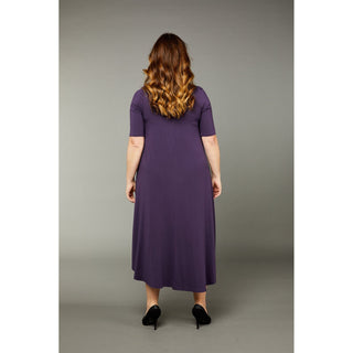 The mulberry color tri dress made from micro modal air fabric is designed to be ultra-soft and stretchy, providing a comfortable and flattering fit for the wearer. The dress features a classic rounded neckline and half-length sleeves, making it appropriate for a variety of occasions. The swing-style shape of the dress has a fitted torso and a voluminous skirt that creates a playful and flirty silhouette