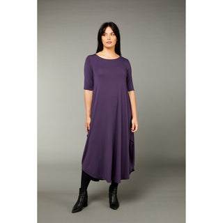 The mulberry color tri dress made from micro modal air fabric is designed to be ultra-soft and stretchy, providing a comfortable and flattering fit for the wearer. The dress features a classic rounded neckline and half-length sleeves, making it appropriate for a variety of occasions. The swing-style shape of the dress has a fitted torso and a voluminous skirt that creates a playful and flirty silhouette