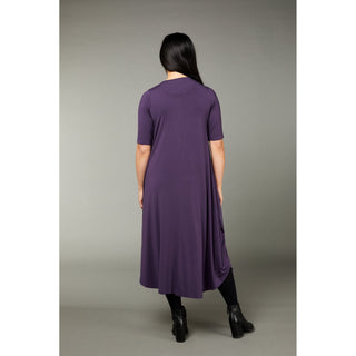 The mulberry color tri dress made from micro modal air fabric is designed to be ultra-soft and stretchy, providing a comfortable and flattering fit for the wearer. The dress features a classic rounded neckline and half-length sleeves, making it appropriate for a variety of occasions. The swing-style shape of the dress has a fitted torso and a voluminous skirt that creates a playful and flirty silhouette