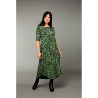 The Tiger print green color tri dress made from micro modal air fabric is designed to be ultra-soft and stretchy, providing a comfortable and flattering fit for the wearer. The dress features a classic rounded neckline and half-length sleeves, making it appropriate for a variety of occasions. 