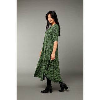 The Tiger print green color tri dress made from micro modal air fabric is designed to be ultra-soft and stretchy, providing a comfortable and flattering fit for the wearer. The dress features a classic rounded neckline and half-length sleeves, making it appropriate for a variety of occasions. 