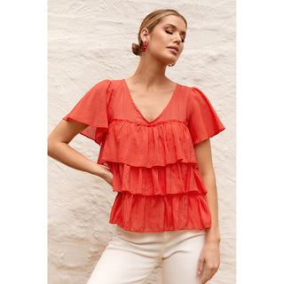 Easy to wear red women's top in a fabric mix of Bamboo/Cotton and Tencel you will make a memorable statement whatever the occasion. When you need to add a bit of Za Za to your outfit go dramatic in our striking Za Za Fril Top in red. Shop online now at Love Moi Boutique.