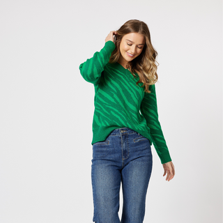 The gorgeous Rio knit v-neck jumper in a stunning jade green color, is perfect for adding a pop of color to any outfit. The jumper also features a trendy tiger print woven pattern in a lighter shade, making it a unique and stylish piece for any wardrobe. 